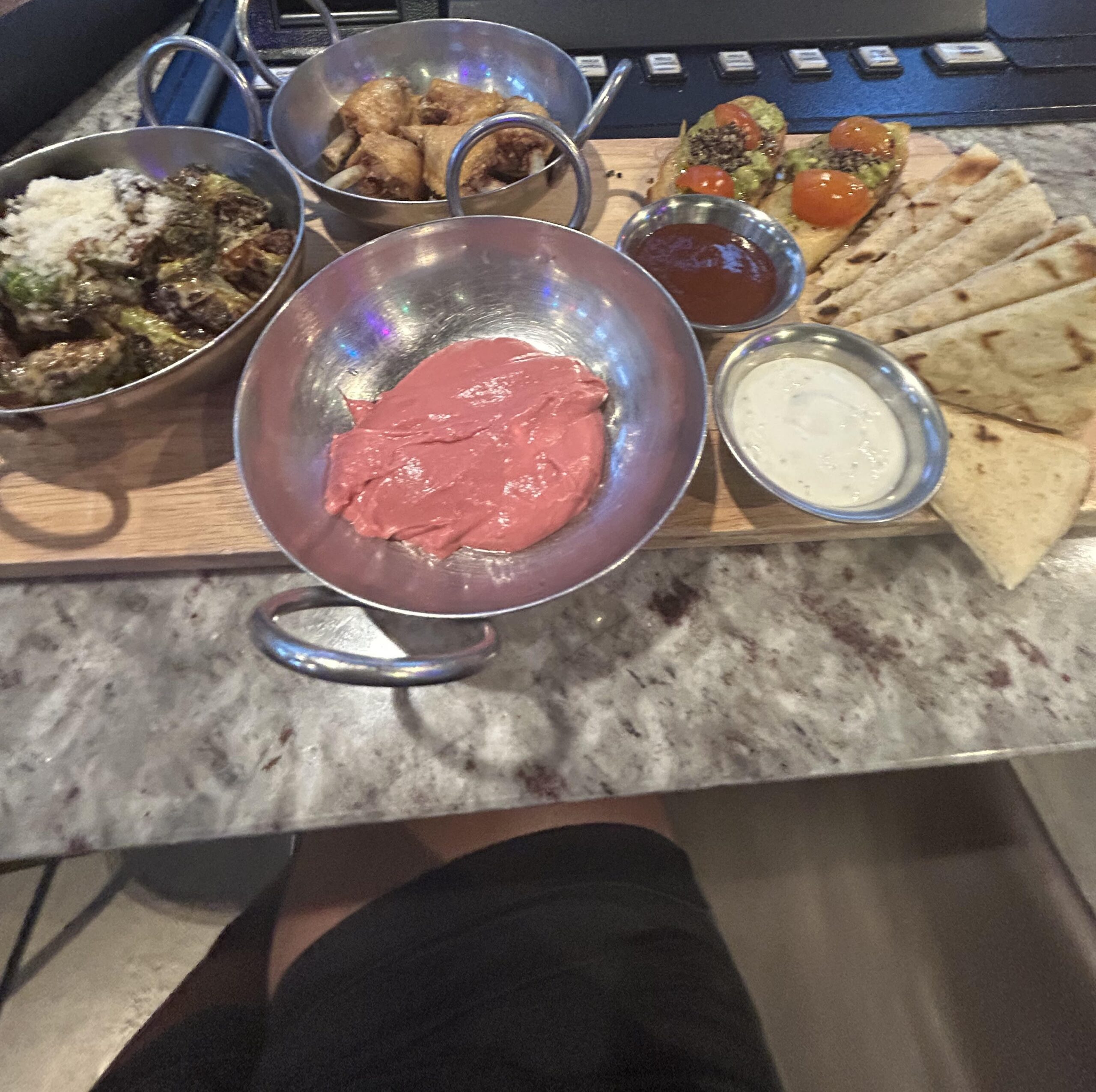 Taverna Tapas Platter$32.00 5-pc lollipop wings with choice of sauce, beet hummus, pita bread, avocado bruschetta, fried Brussels sprouts; add pita bread (5) or beet hummus